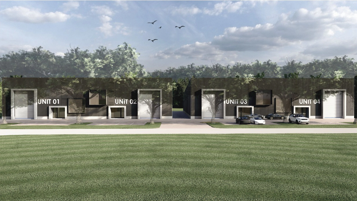 Street-level view of four interconnected modern industrial units (Unit 01, Unit 02, Unit 03, Unit 04) with dark facades, large windows, and a green lawn in the foreground